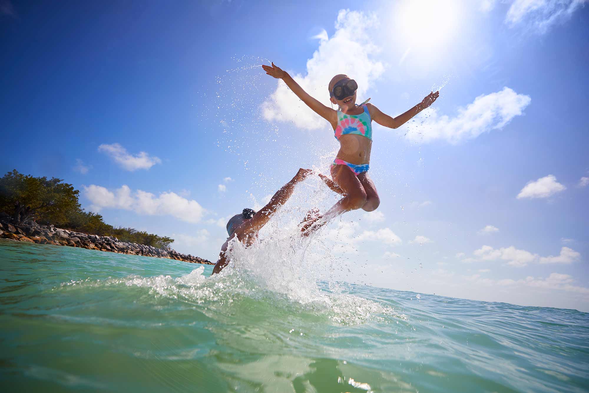 Billy Kearns playing with his kids in the water